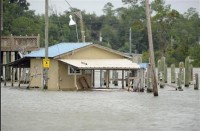 Water floods the bait shop at the Ocean Springs Harbor as Hurricane Isaac approaches Ocean Springs, Mississippi. Photo: REUTERS/Michael Spooneybarger