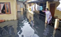 These homes in Pandu, a town in the Indian state of Assam, were among the areas still under water on Monday. Photo: Utpal Baruah/Reuters