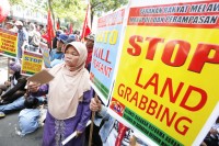Defending rights: In this stock photograph dated June 4, farmers and activists rally in front of the National Land Agency in Jakarta to call for an end to land grabbing and the implementation of agrarian reform. Many people have been displaced due to agrarian conflicts in Indonesia, activists say. Photo: JP/Jerry Adiguna
